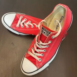 Red Converse. Size 8 in men’s. Size 10 in women’s.